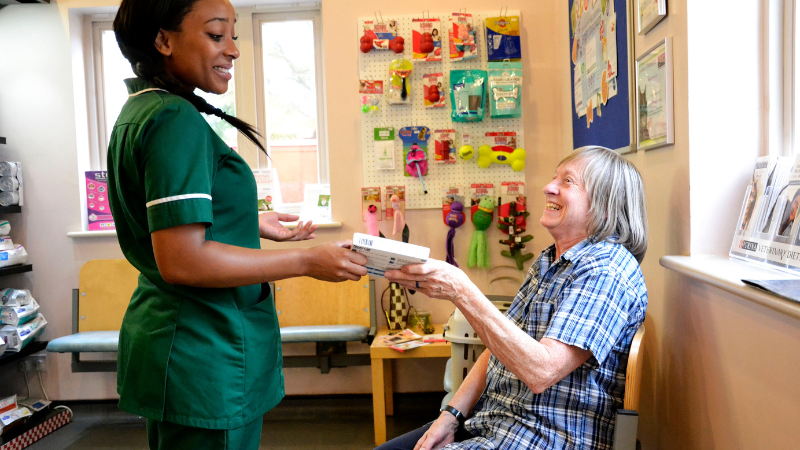 SQP dispensing flea medication to a client