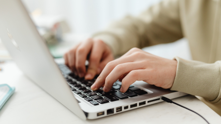 Person typing on a laptop