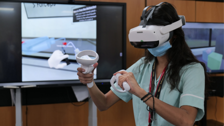 Student veterinary nurse wearing a virtual reality headset