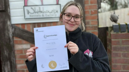 Student holding up her Level 3 Animal Care and Welfare Manager Apprenticeship certificate