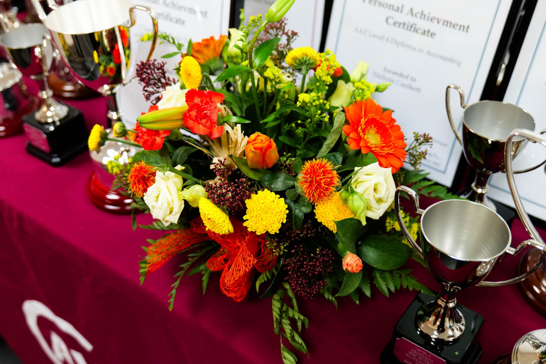 Student Awards 2023 table filled with trophies and certificates