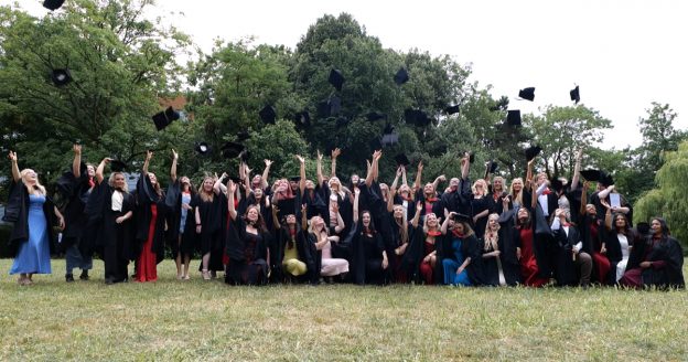 BSc graduation 2025 - graduates throwing their caps in the air.