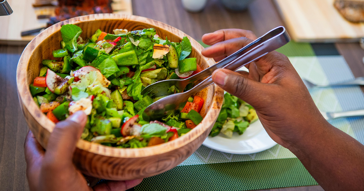 A wooden bowl of healthy salad