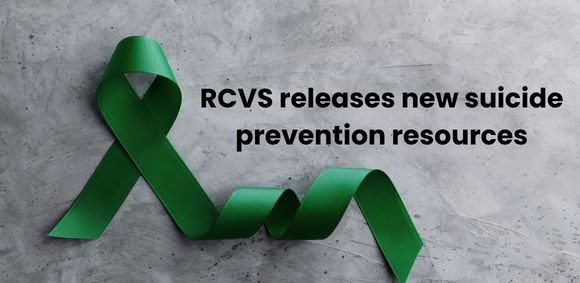 Green ribbon loop on a grey marble background, black text reads "RCVS releases new suicide prevention resources"